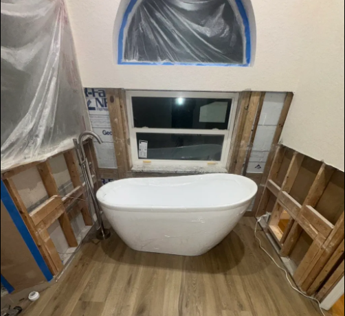 Freestanding bathtub installed during a bathroom remodel