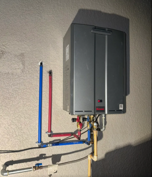 Wall-mounted tankless water heater with new water and gas line connections