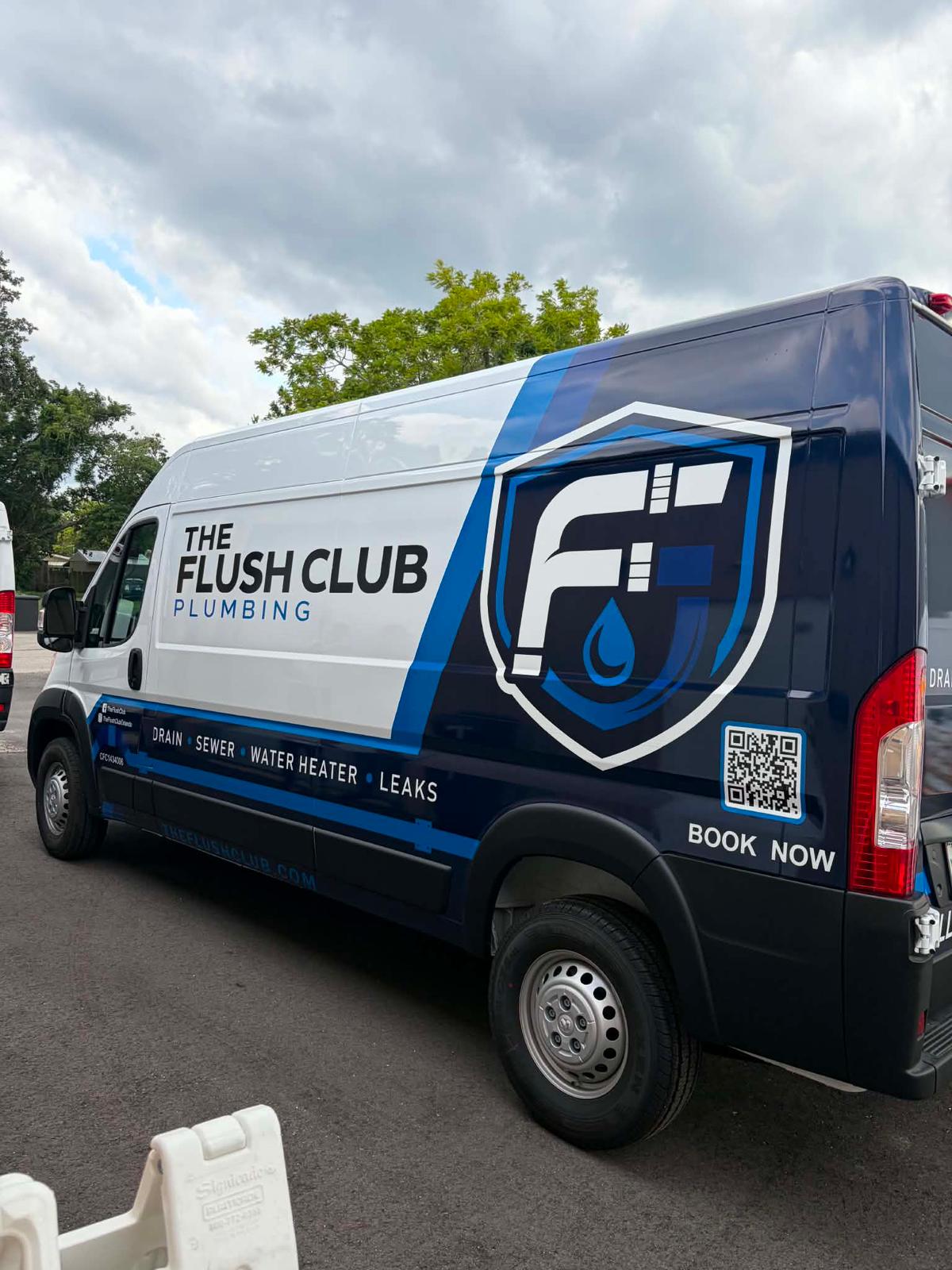 The Flush Club Plumbing service van parked on a residential street