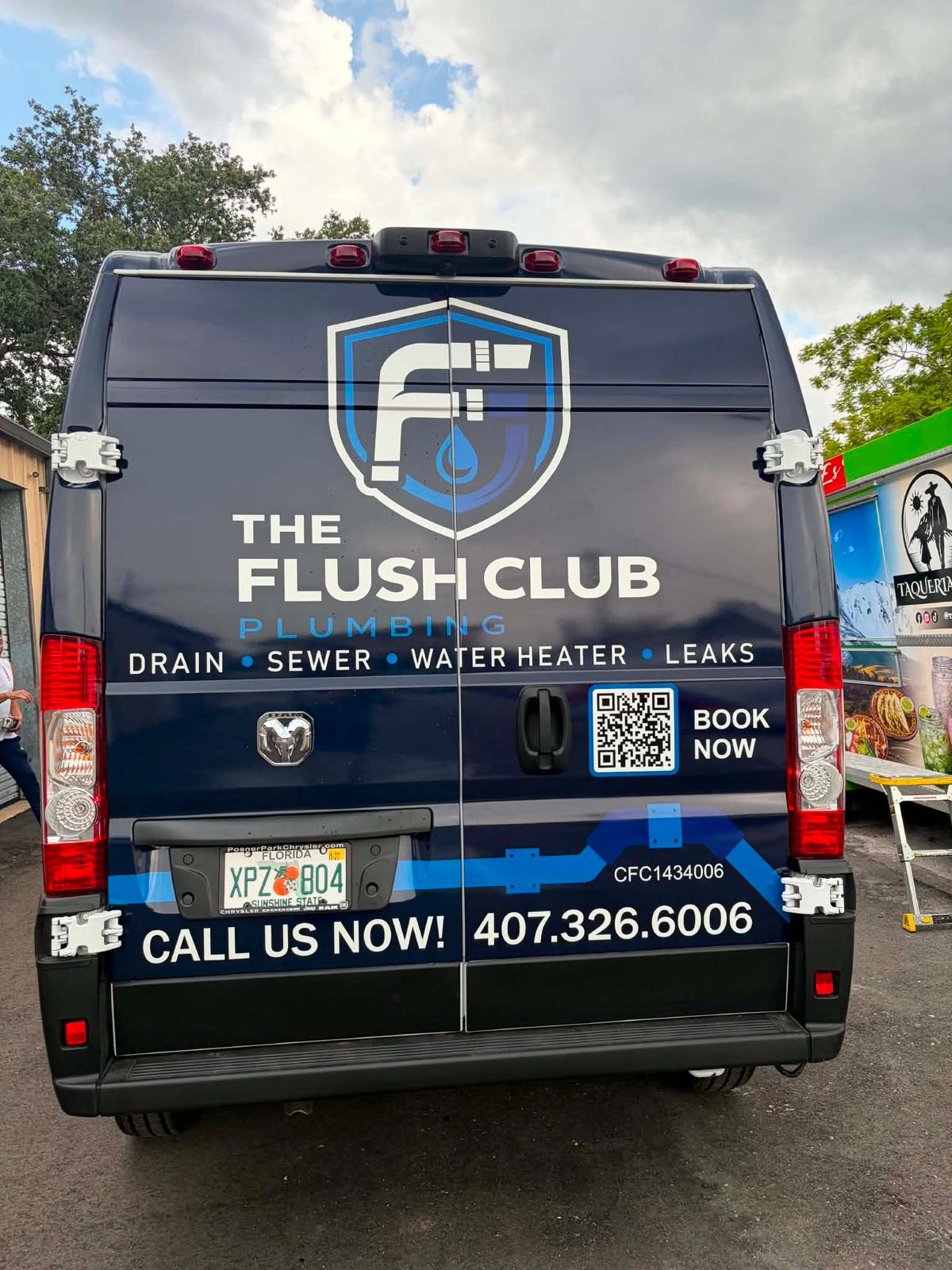 Back of The Flush Club Plumbing van showing the 407-326-6006 phone number